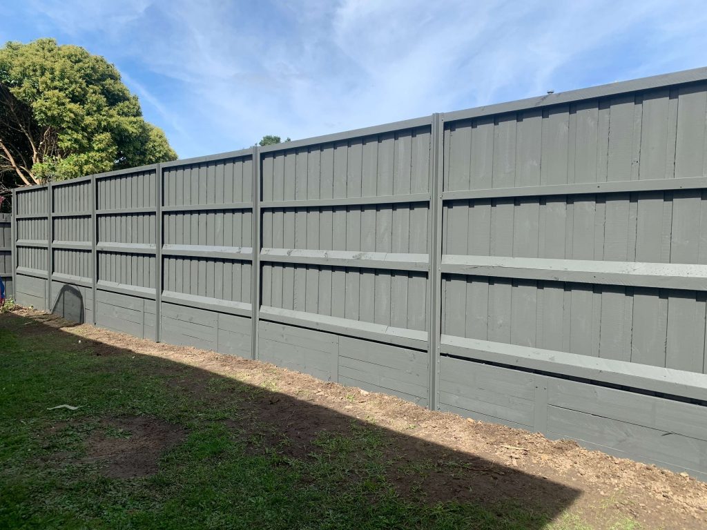 Picture Of A Fence Painting Job After Work Is Completed